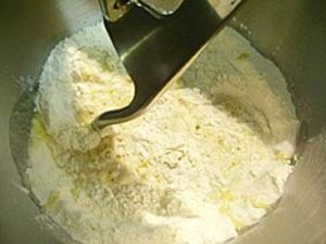 kneading the pizza dough at home image