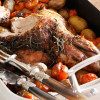 HERB-ROASTED LEG OF LAMB WITH CHERRY TOMATOES & POTATOES thumbnail