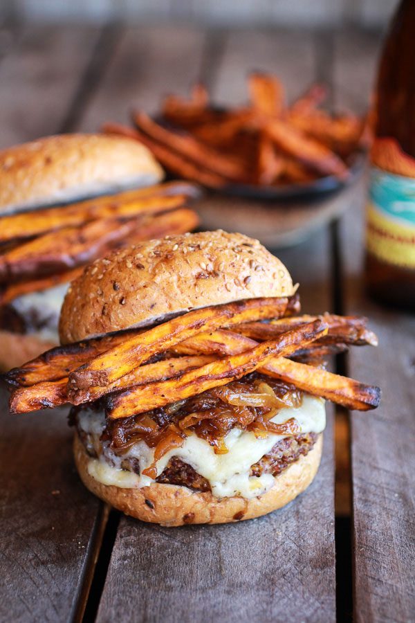Crispy Quinoa Burgers Topped with Sweet Potato Fries-Beer Caramelized Onions