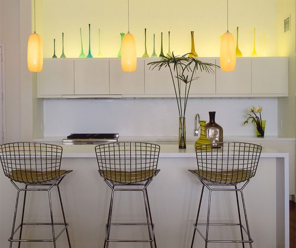 colored vases above cabinets