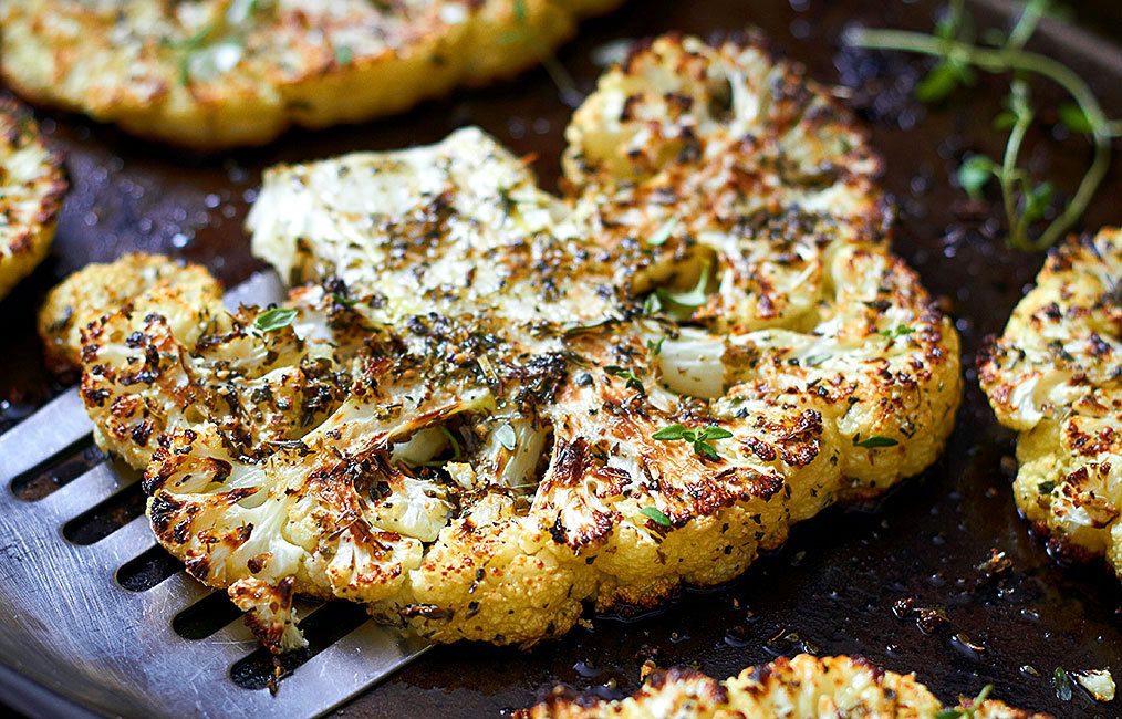 Imagine delicious, well-seasoned, creamy roasted cauliflower. Now imagine it in the form of thick, steak-like slabs.