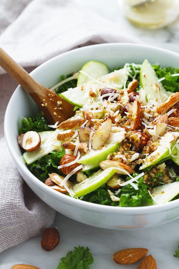 Kale Salad with Apple Almond Hazelnut and Apple Cider Dressing - #recipe by #eatwell101 - https://www.eatwell101.com/kale-salad-recipe