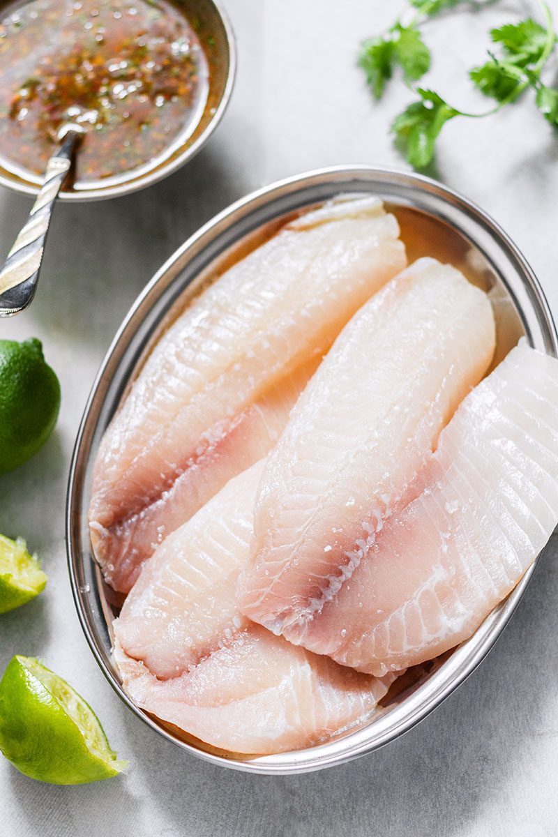 Sheet-Pan Chili-Lime Tilapia Recipe with Veggies - #eatwell101 #recipe #fish #sheetpan #dinner - A super easy, quick, and healthy sheet-pan meal for busy weeknights!