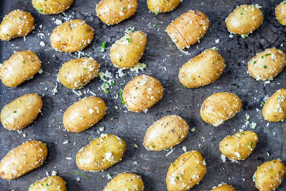 Cheesy Garlic Roasted Potatoes – Crunchy golden exteriors, soft and creamy inside. A great side dish to share with a crowd!