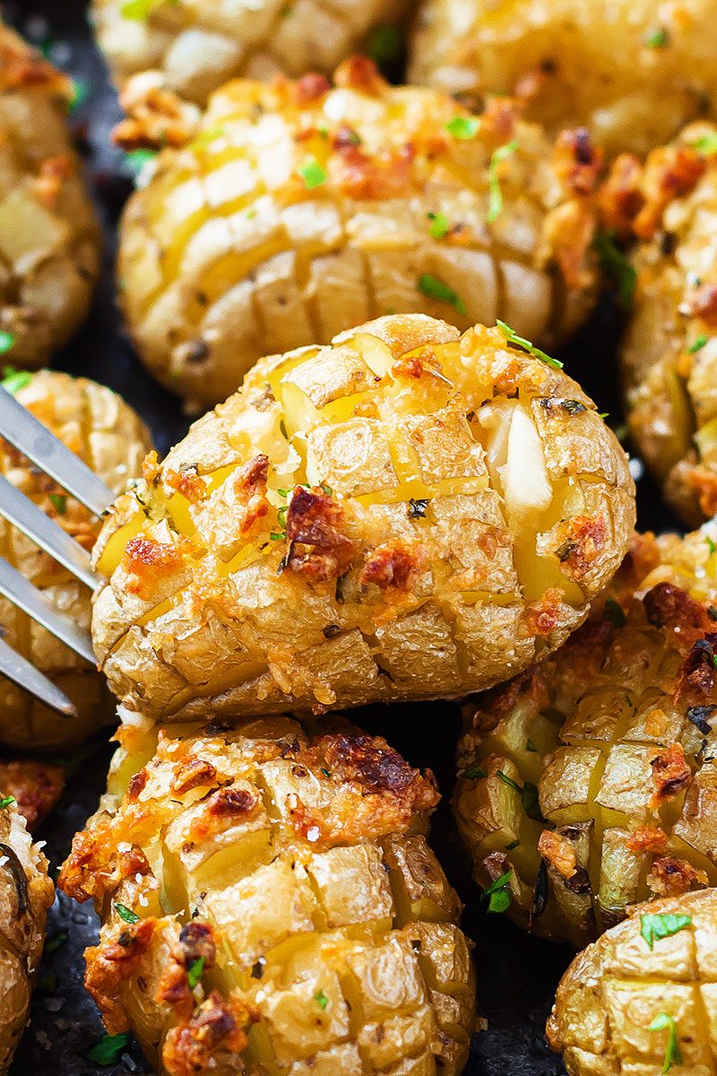 Cheesy Garlic Roasted Potatoes – Crunchy golden exteriors, soft and creamy inside. A great side dish to share with a crowd!