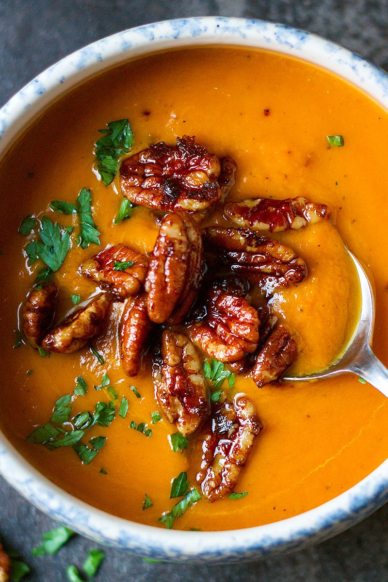 Creamy Carrot Soup with Caramelized Pecans — Super healthy and smooth with an irresistible bit of crunch!