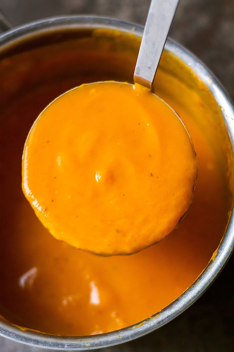 Creamy Carrot Soup with Caramelized Pecans — Super healthy and smooth with an irresistible bit of crunch!