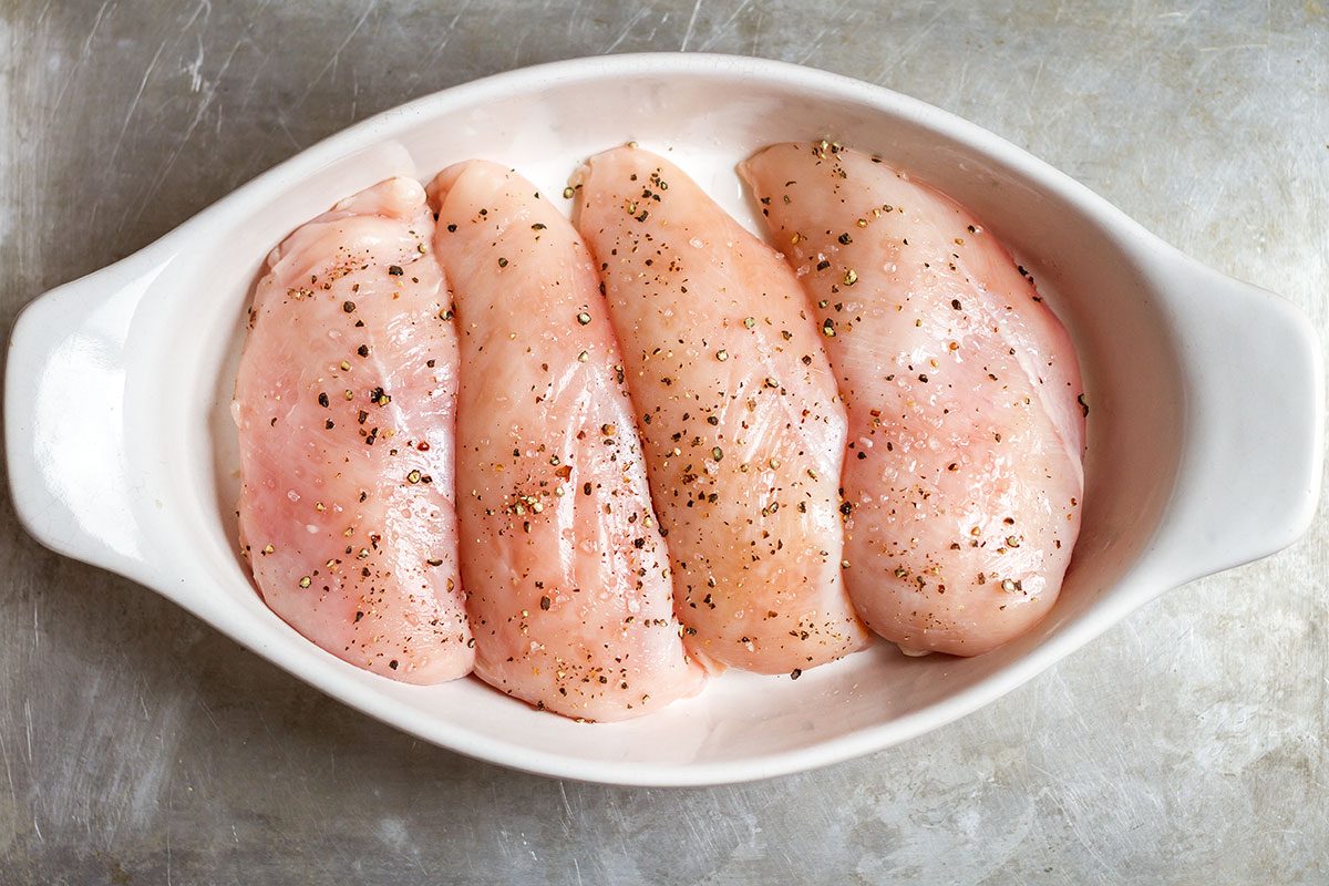 Baked Chicken Breasts with Sticky Honey Sriracha Sauce — Bursting with flavor and perfectly juicy. Say goodbye to bland, and dry oven baked chicken!