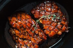Slow Cooker Pork Belly with Honey Balsamic Glaze - Fall-apart tender and infused with a sticky tangy glaze.