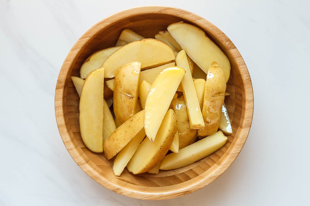 Baked Garlic Parmesan Potato Wedges - Crispy on the outside and tender on the inside, they will blow you away with their simplicity and fantastic flavor!