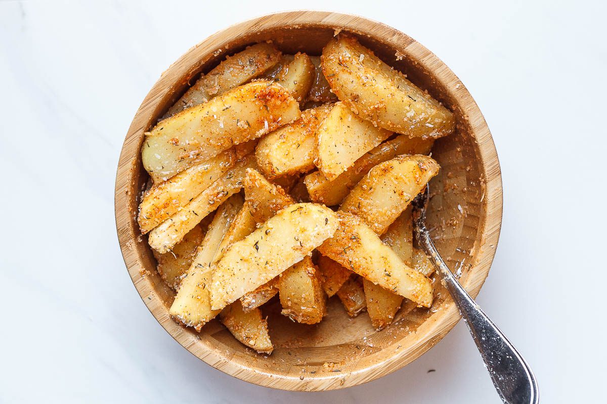 Baked Garlic Parmesan Potato Wedges - Crispy on the outside and tender on the inside, they will blow you away with their simplicity and fantastic flavor!