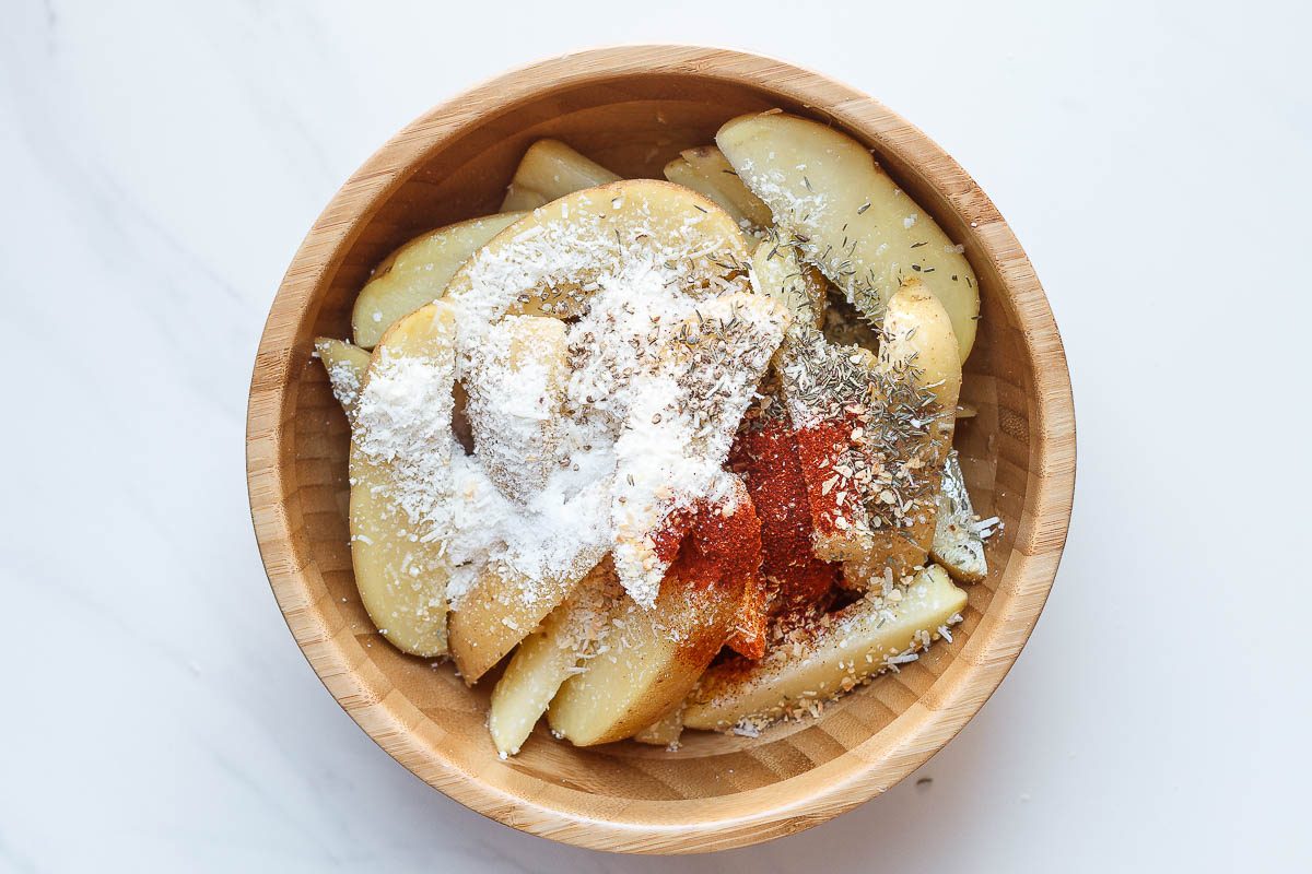 Baked Garlic Parmesan Potato Wedges - Crispy on the outside and tender on the inside, they will blow you away with their simplicity and fantastic flavor!