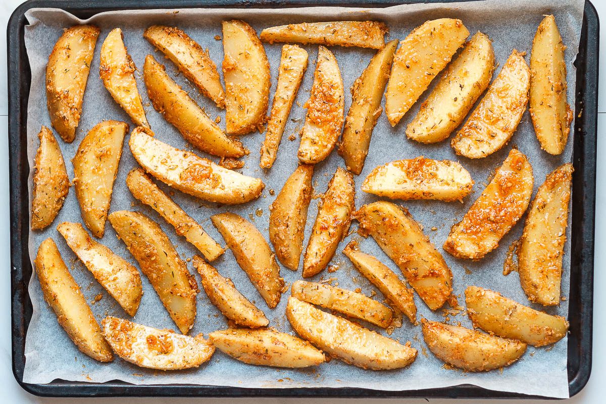 Baked Garlic Parmesan Potato Wedges - Crispy on the outside and tender on the inside, they will blow you away with their simplicity and fantastic flavor!