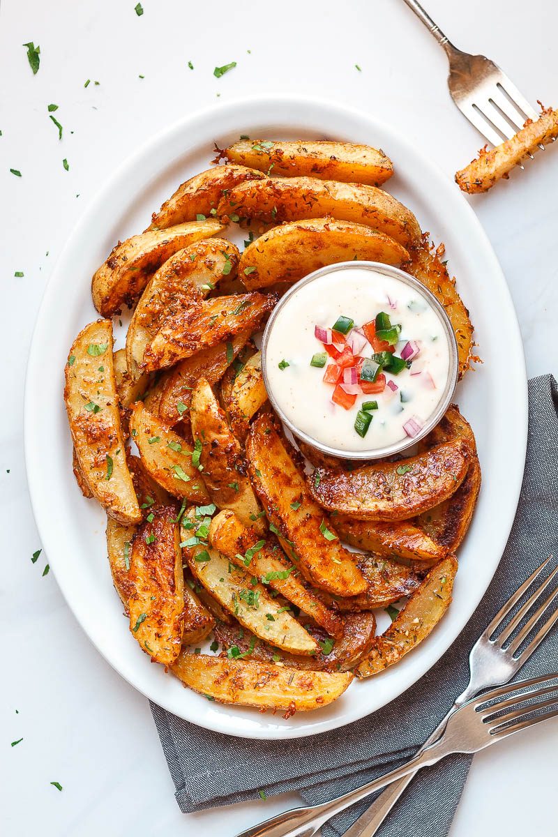Baked Garlic Parmesan Potato Wedges - Crispy on the outside and tender on the inside, they will blow you away with their simplicity and fantastic flavor!