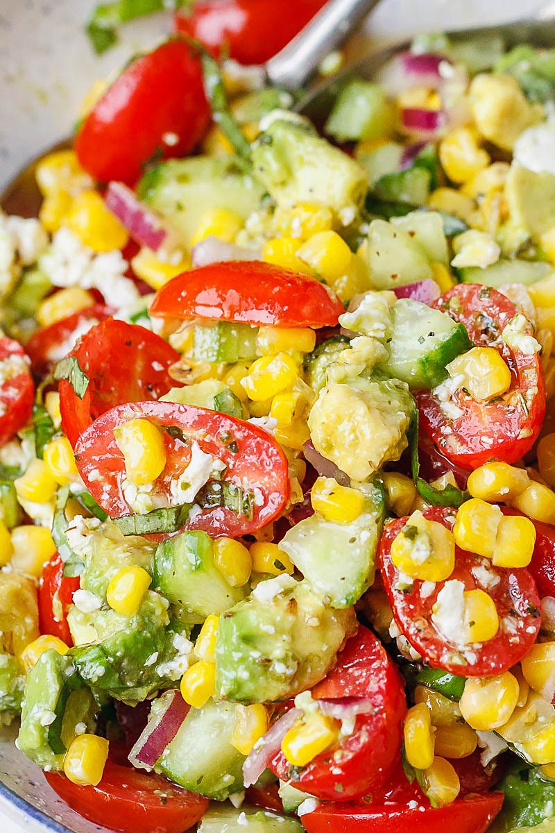 Avocado Feta Corn Salad Recipe - So much creaminess and flavor! This avocado corn salad is a light, yet satisfying meal.