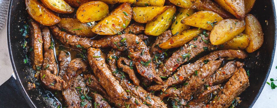 Garlic Butter Steak and Potatoes Skillet - This easy one-pan recipe is SO simple, and SO flavorful. The best steak and potatoes you'll ever have!