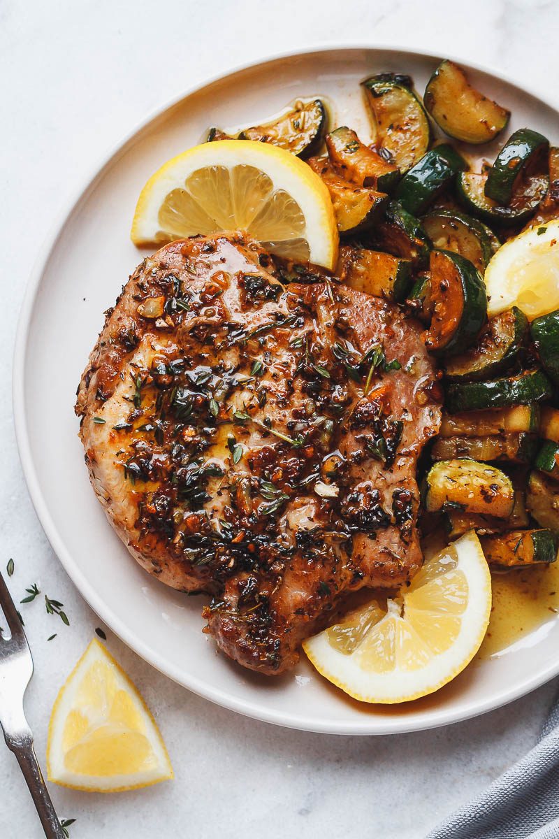 Garlic Butter Herb Pork Chops with Zucchini - This complete Paleo meal is quick, easy and effortless!