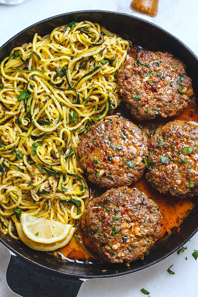 Cheesy Garlic Burgers with Lemon Butter Zucchini Noodles - Rich and juicy, you'll instantly fall in love with these hamburger patties served with plenty of lemony zucchini noodles. - #recipe by #eatwell101