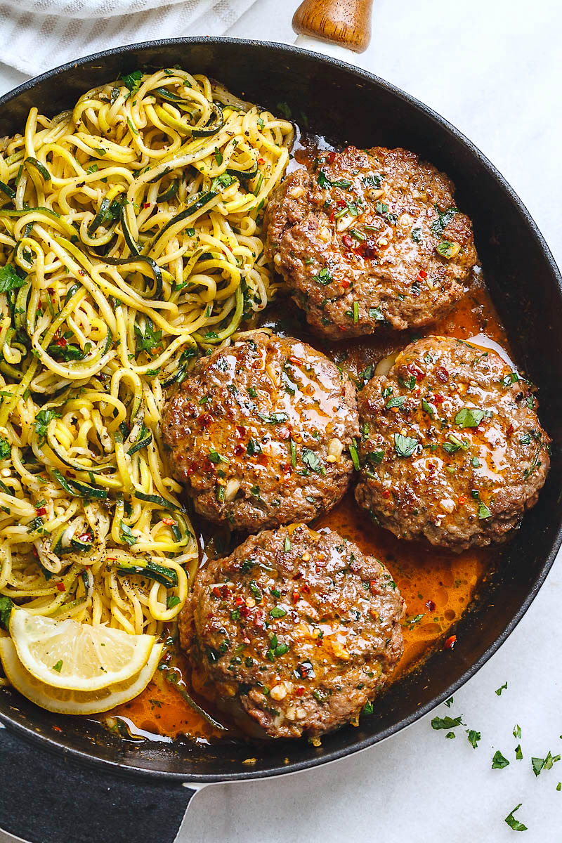 Cheesy Garlic Burgers with Lemon Butter Zucchini Noodles - Rich and juicy, you'll instantly fall in love with these hamburger patties served with plenty of lemony zucchini noodles. - #recipe by #eatwell101