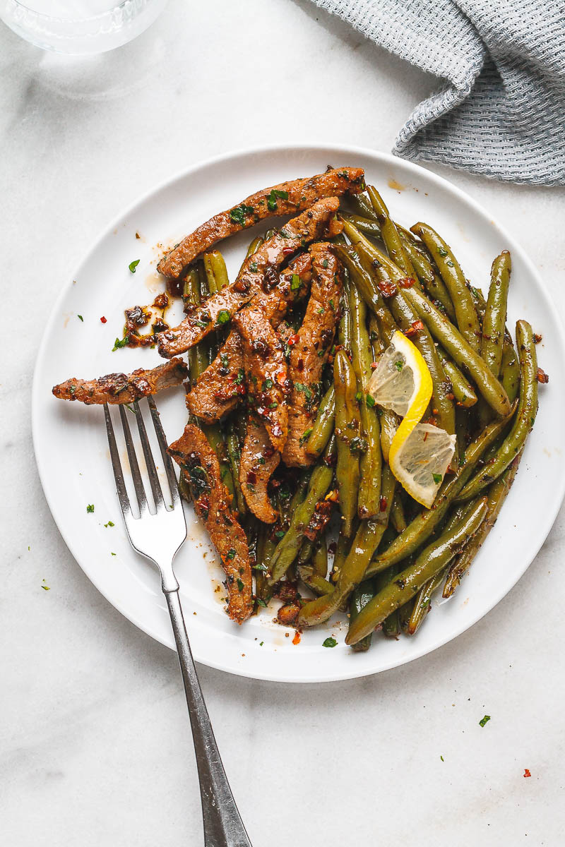 Garlic Butter Steak and Lemon Green Beans Skillet - So addicting! The flavor combination of this quick and easy one pan dinner is spot on!
