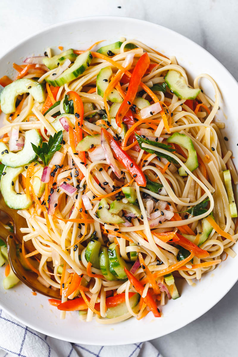 Asian Noodle Salad - With the Best Ever Ginger Vinaigrette. This vegan make-ahead salad is loaded up with healthy veggies and perfect for midweek lunches or larger gatherings.