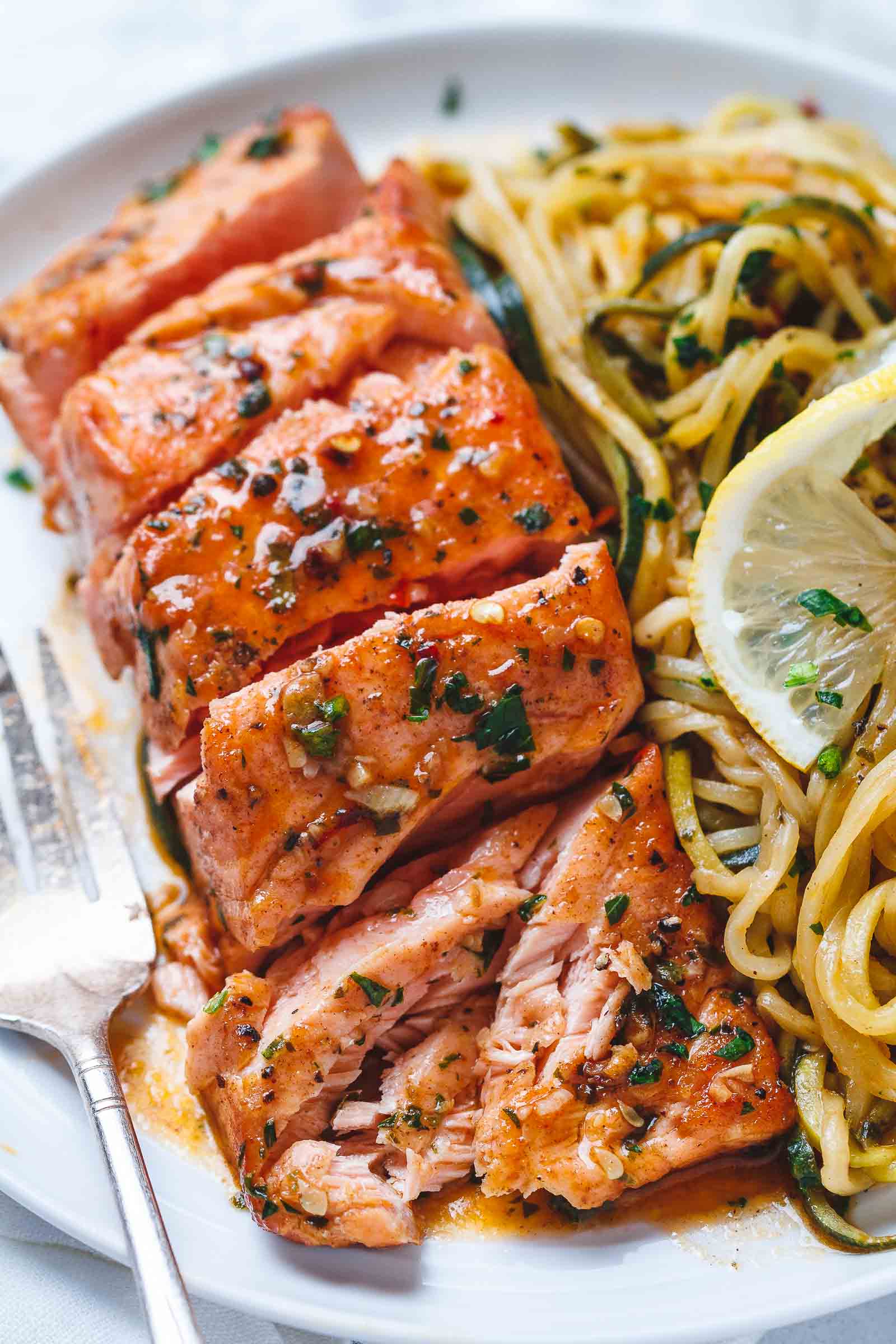 Lemon Garlic Butter Salmon with Zucchini Noodles - #eatwell101 #recipe #salmon #keto #paleo #lowcarb - Light, low carbs and ready in 20 minutes. Dinner perfection for any weeknight!