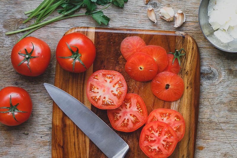 Baked Parmesan Tomatoes - Healthy and so delicious! If you’re looking for an easy low carb side for a quick dinner try these baked parmesan tomatoes.