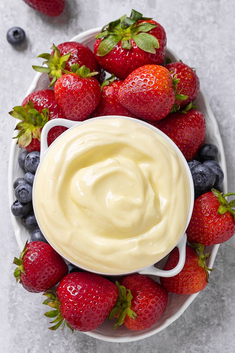 Cream Cheese Fruit Dip recipe - Lightly sweet and super fluffy, this fruit dip is a great way to get everyone to eat more fruit this season!