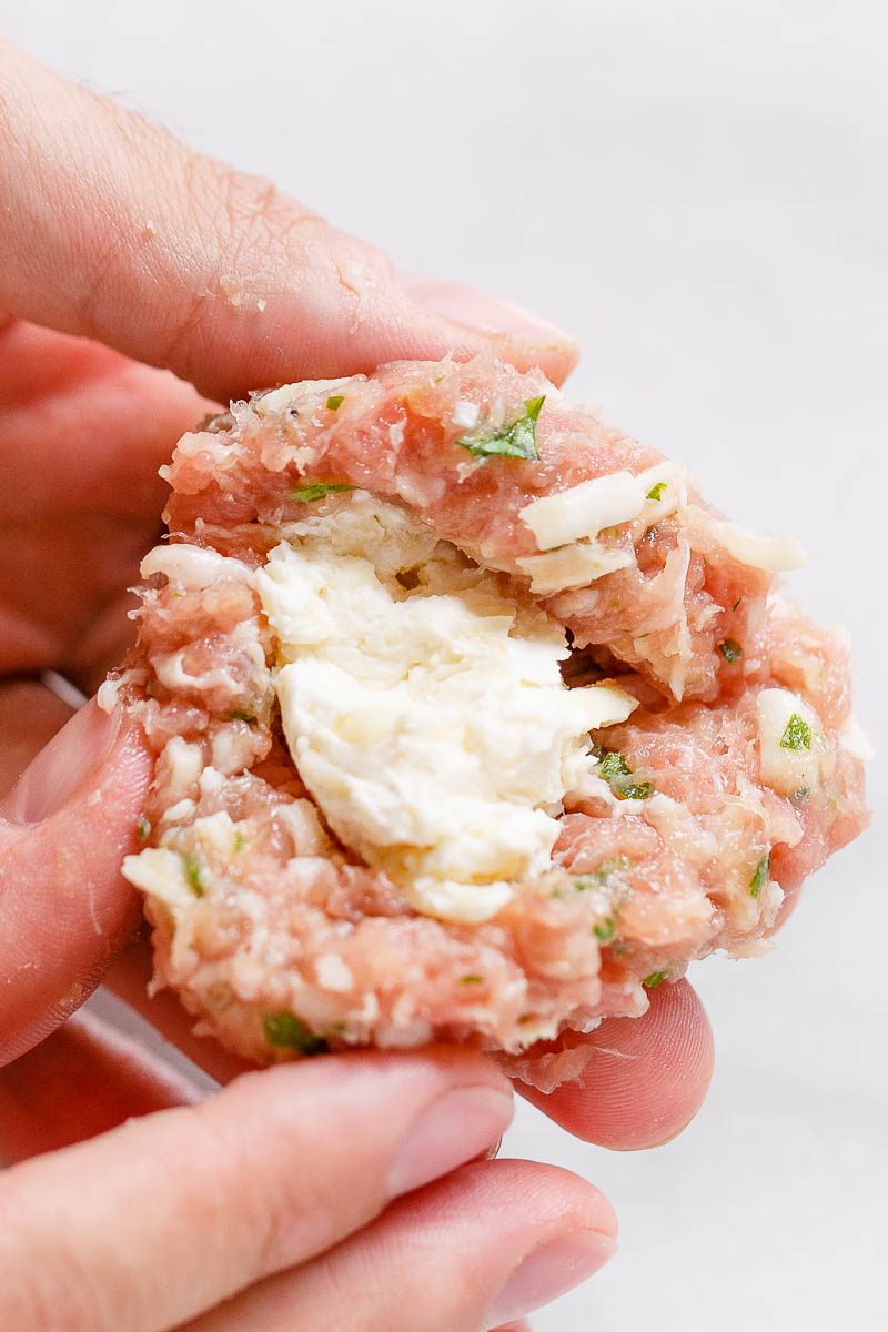 Cheesy Stuffed Turkey Meatballs with Cauliflower Rice - A rich and indulgent plate of comfort with a healthy twist!