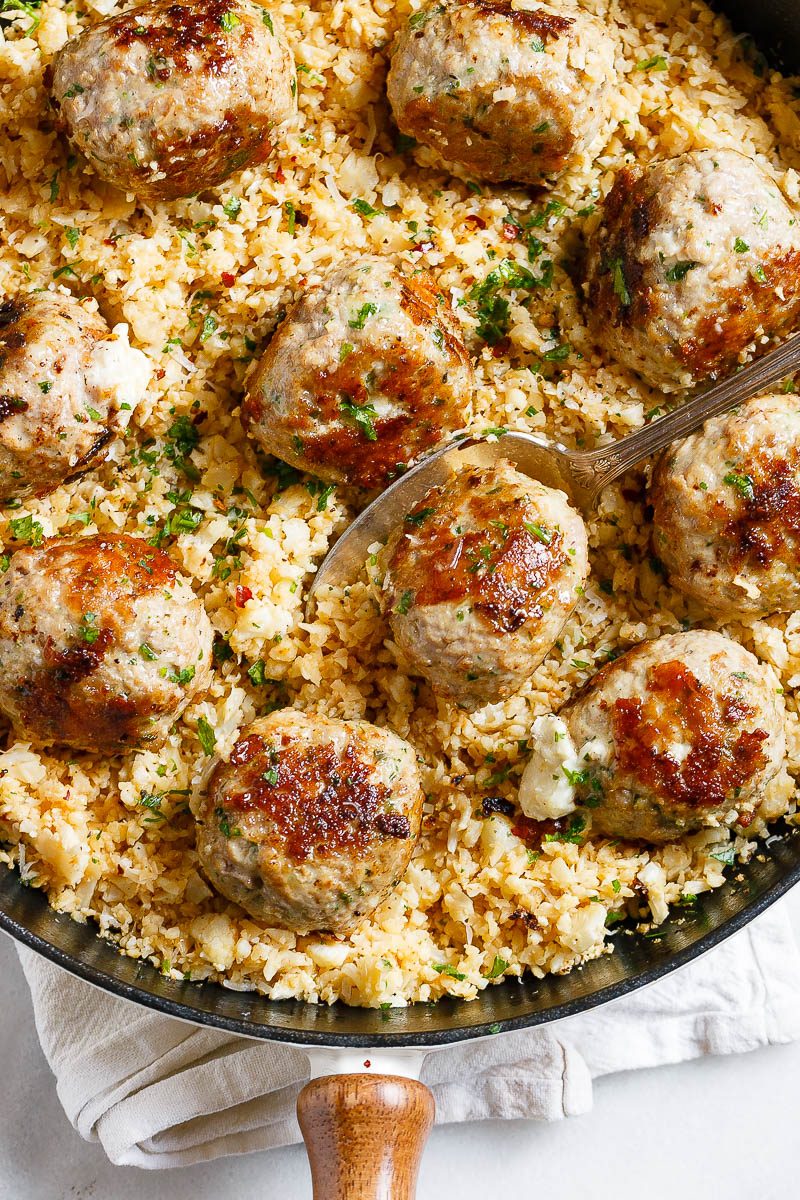 Cheesy Stuffed Turkey Meatballs with Cauliflower Rice - A rich and indulgent plate of comfort with a healthy twist!