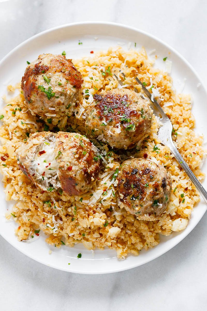 Cheesy Stuffed Turkey Meatballs with Cauliflower Rice - A rich and indulgent plate of comfort with a healthy twist!