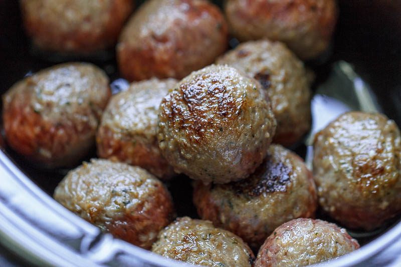 Slow Cooker Italian Sausage Meatballs - A dreamy and hearty, comfort-style slow cooker recipe that's too good NOT to be on rotation!
