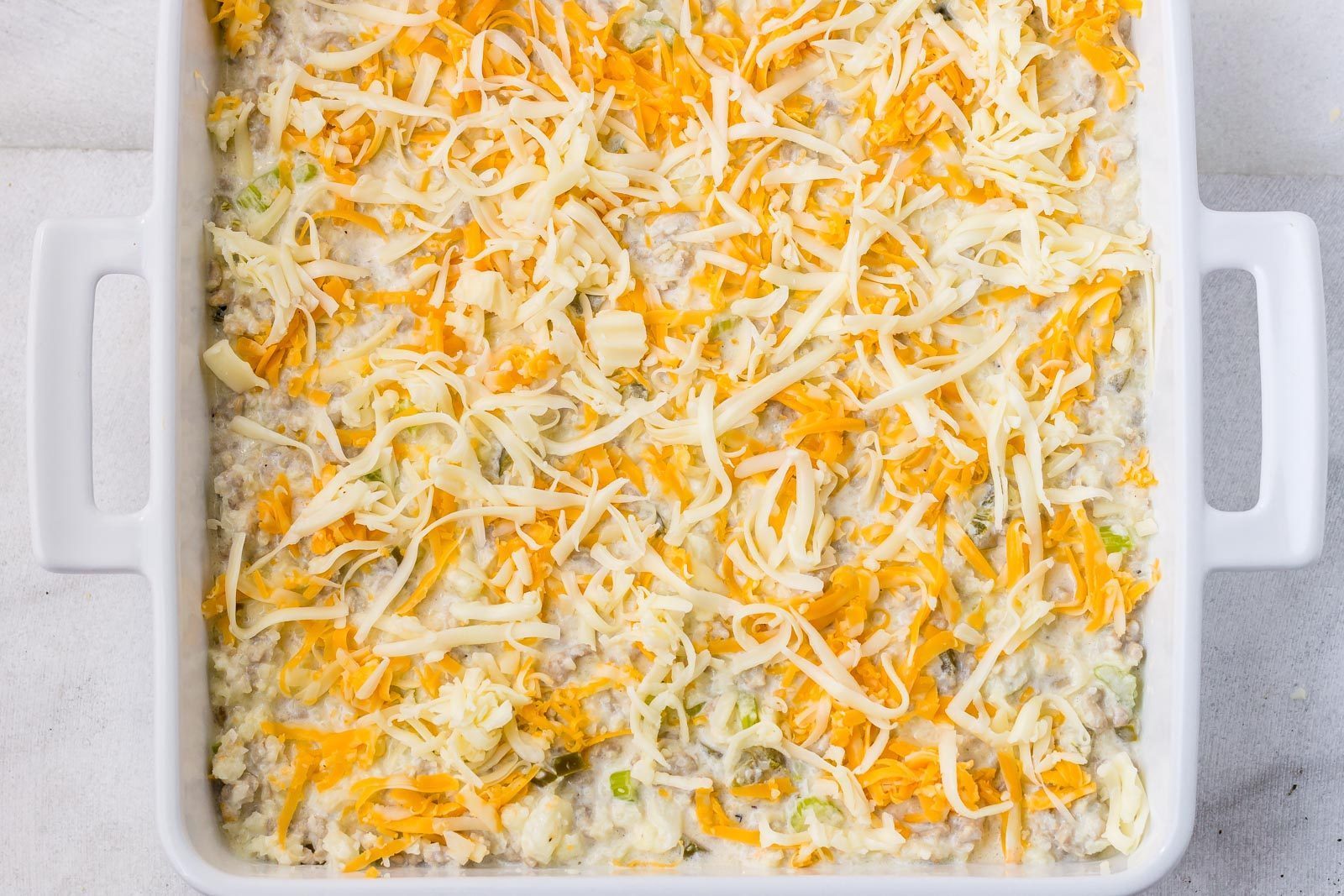 Green Chile Cauliflower Casserole - Warm and addicting comfort food alert! A quick, easy and great for your weekly meal rotation!