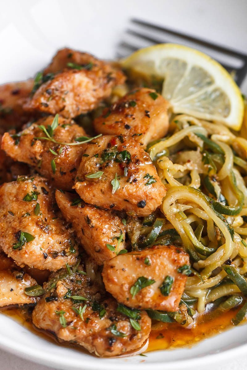 Garlic Butter Chicken Bites with Lemon Zucchini Noodles Recipe - #eatwell101 #recipe They're so juicy, tender, and delicious you'll eat them hot right off the pan! Ready for a new #chicken #dinner winner?