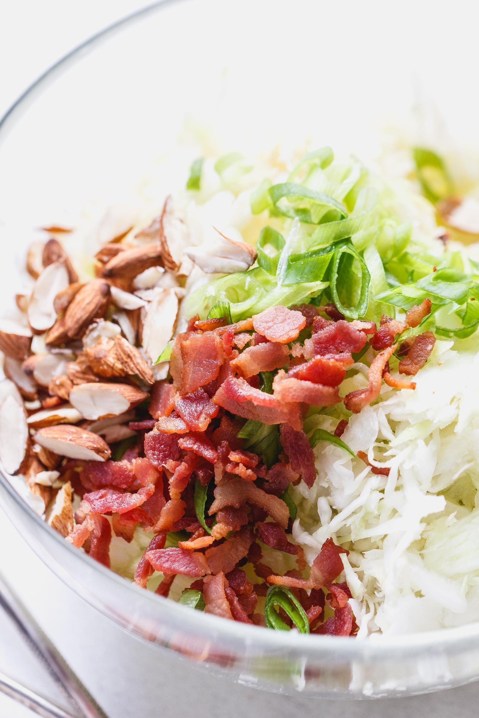 Apple Bacon Coleslaw - Super creamy, crunchy, and fresh! This coleslaw recipe only takes a few minutes to make and is packed with bright and delicious flavor!