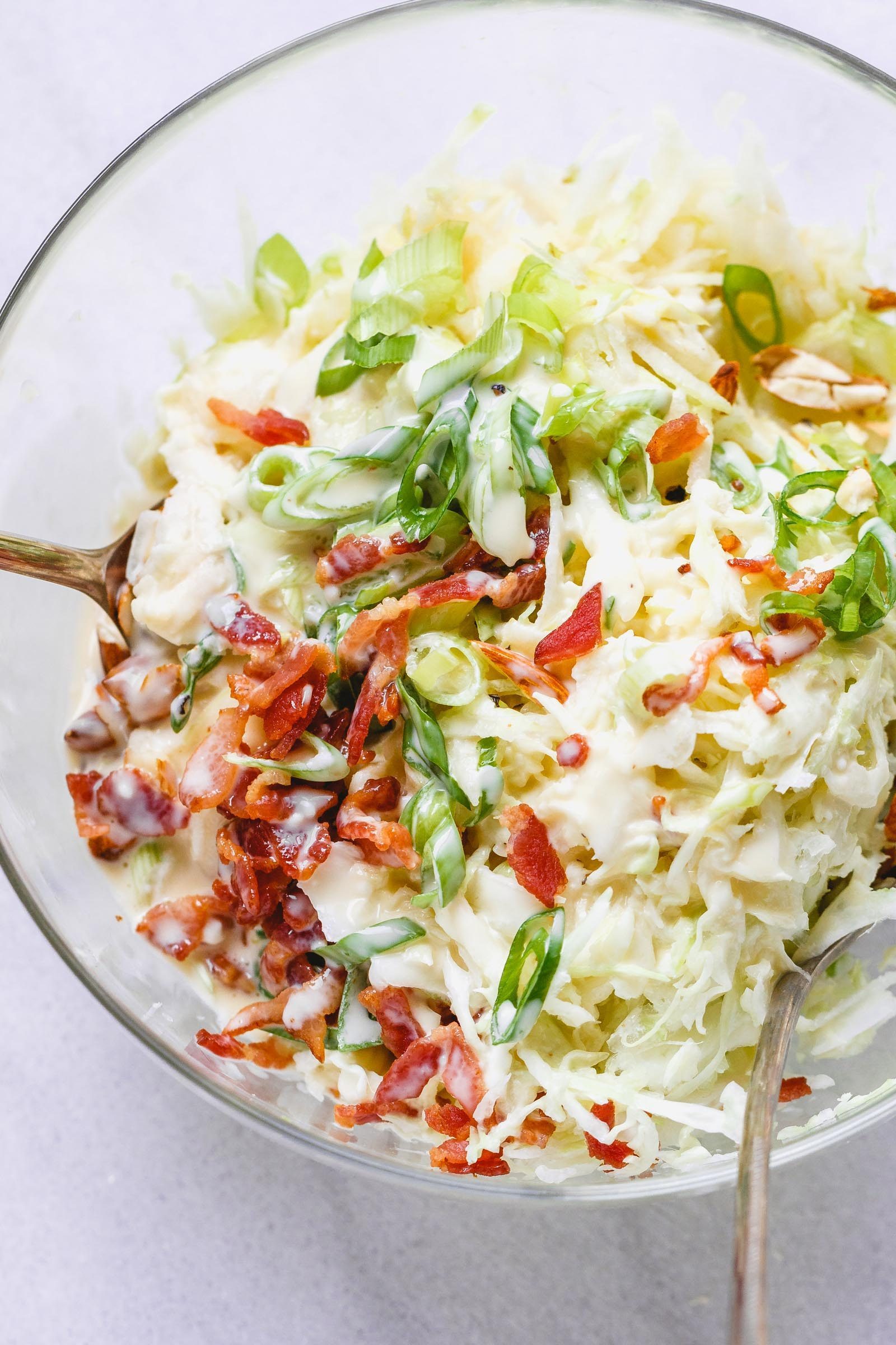 Apple Bacon Coleslaw - Super creamy, crunchy, and fresh! This coleslaw recipe only takes a few minutes to make and is packed with bright and delicious flavor!