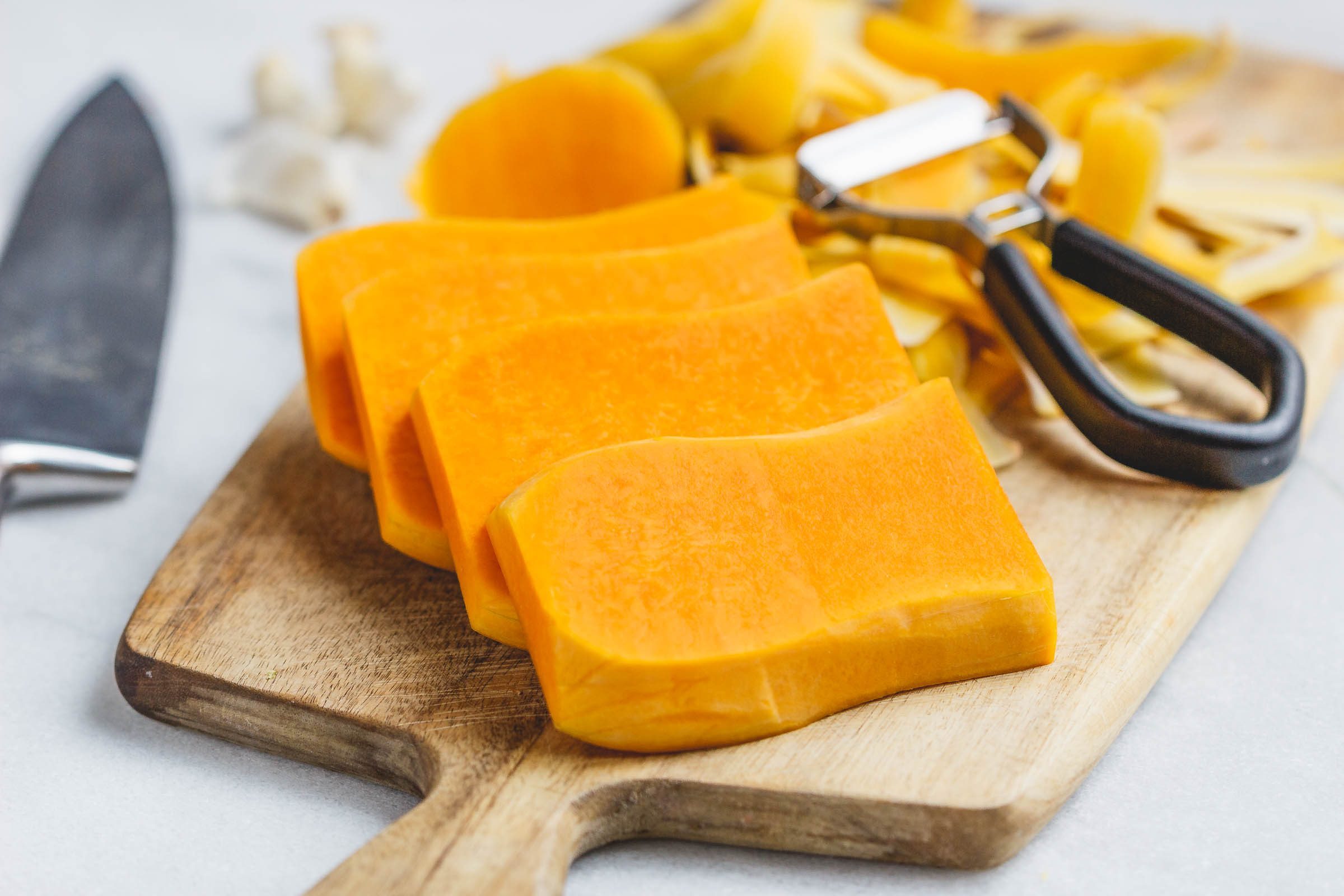 Garlic Butter Butternut Squash Steaks - Melt-in-your-mouth tender and packed with flavor! A super easy and delicious side dish for the holidays.