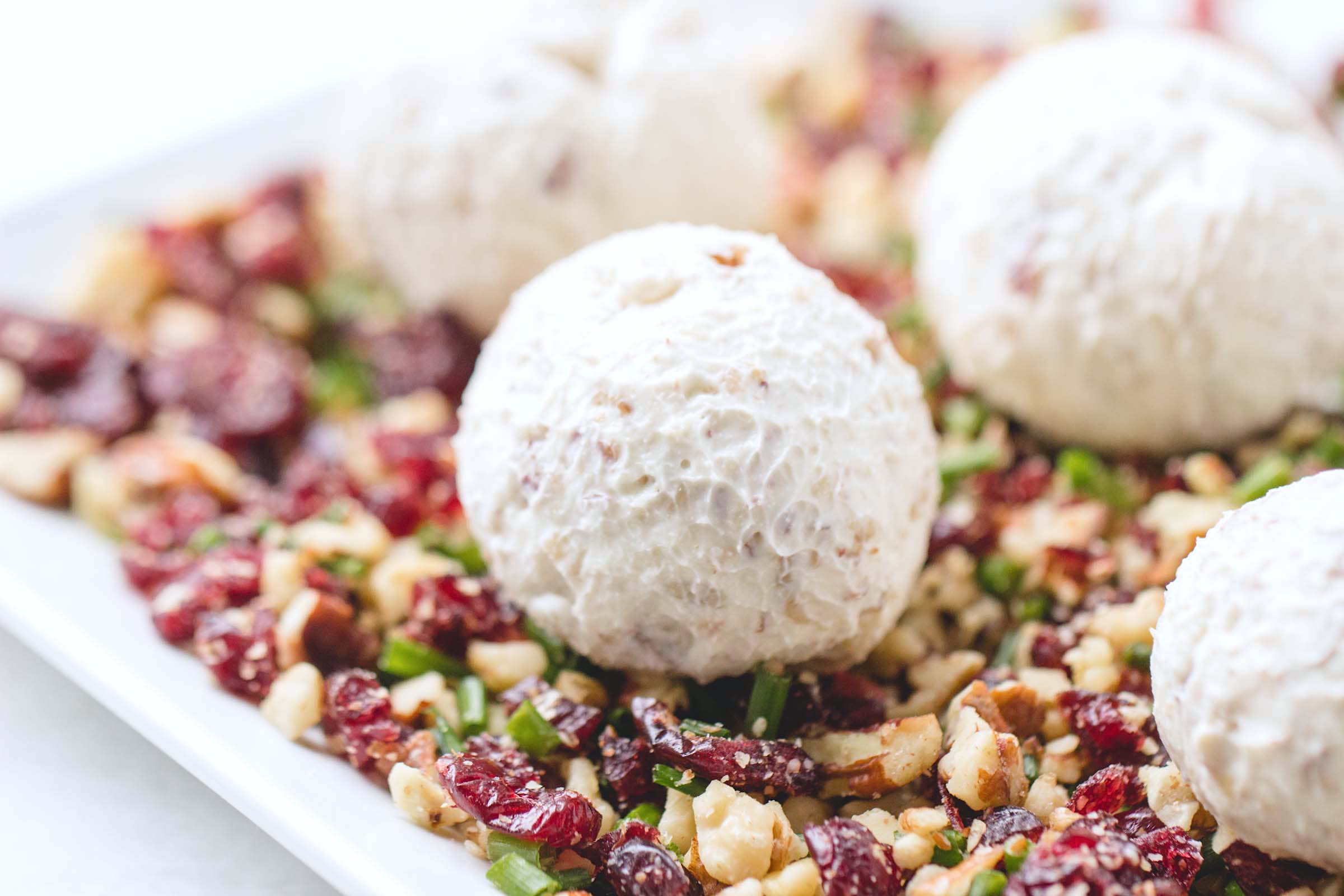 Cranberry Nut Cream Cheese Balls - These super festive cheese balls won't last long on your table - definitely a crowd pleaser!