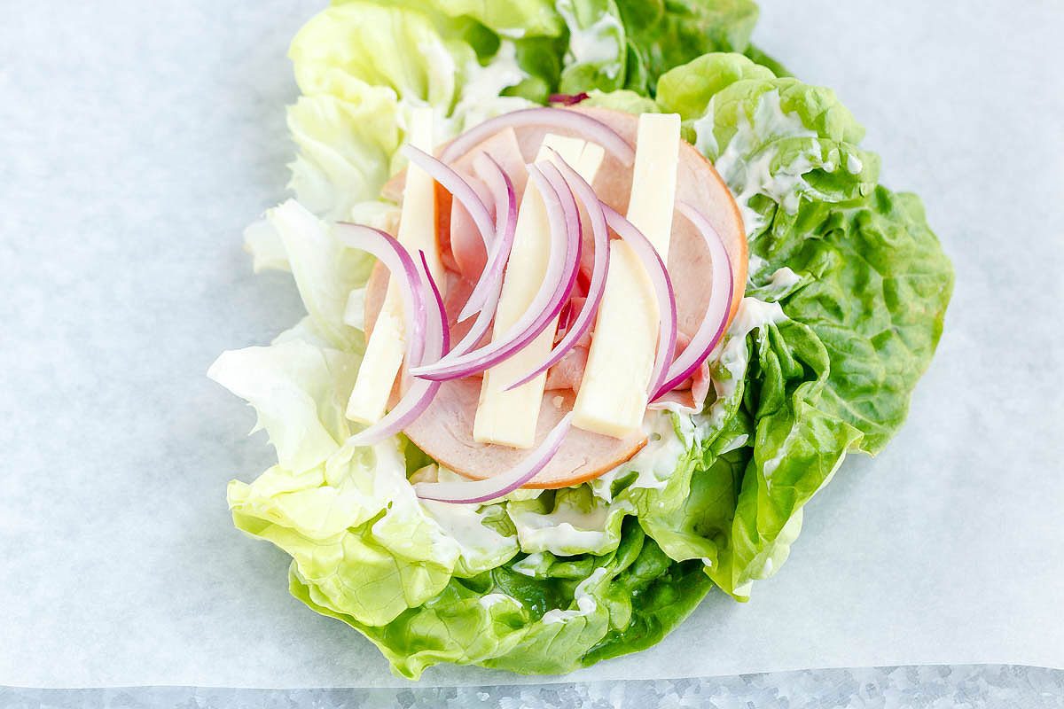How to Make a Lettuce Wrap Sandwich - This low-carb sandwich is the perfect option for lunch on the go, at work, or ont the campus. Paleo, gluten-free and keto friendly - Win!