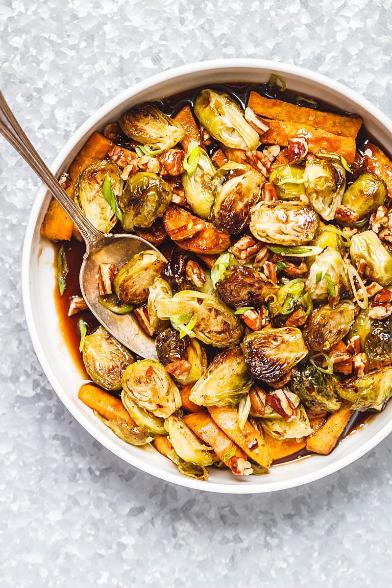 Roasted Brussels Sprouts and Sweet Potato with Balsamic Honey Glaze – Wonderfully homey and comforting! This tasty side-dish is perfect for the holidays or any time this fall.