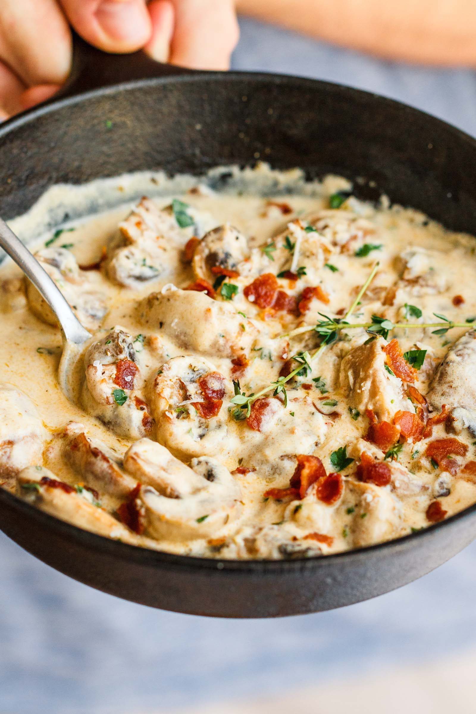 Creamy Garlic Parmesan Mushrooms with Bacon - A decadent garlic parmesan mushroom cream sauce that will have you licking your plate clean!