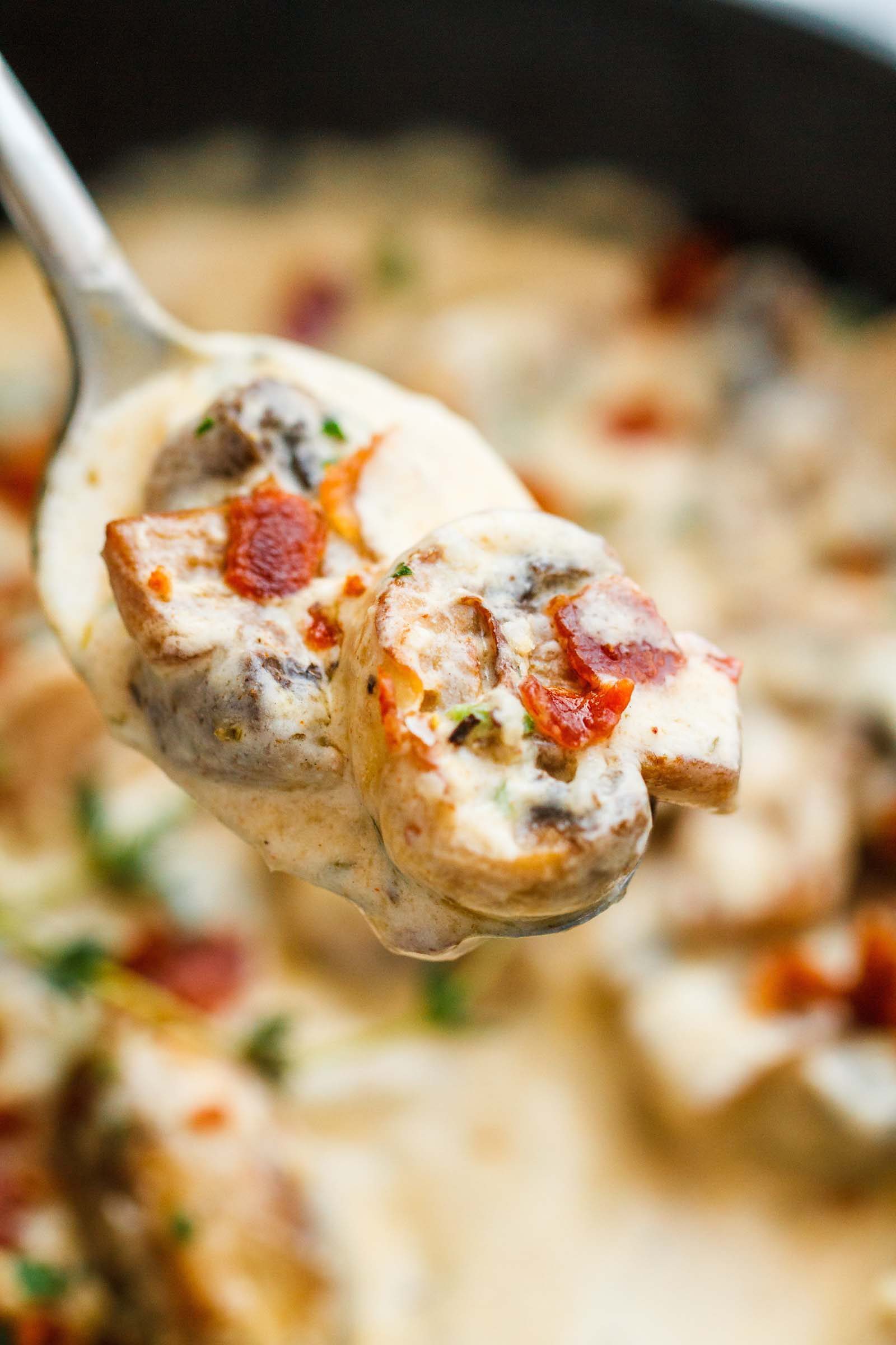 Creamy Garlic Parmesan Mushrooms with Bacon - A decadent garlic parmesan mushroom cream sauce that will have you licking your plate clean!