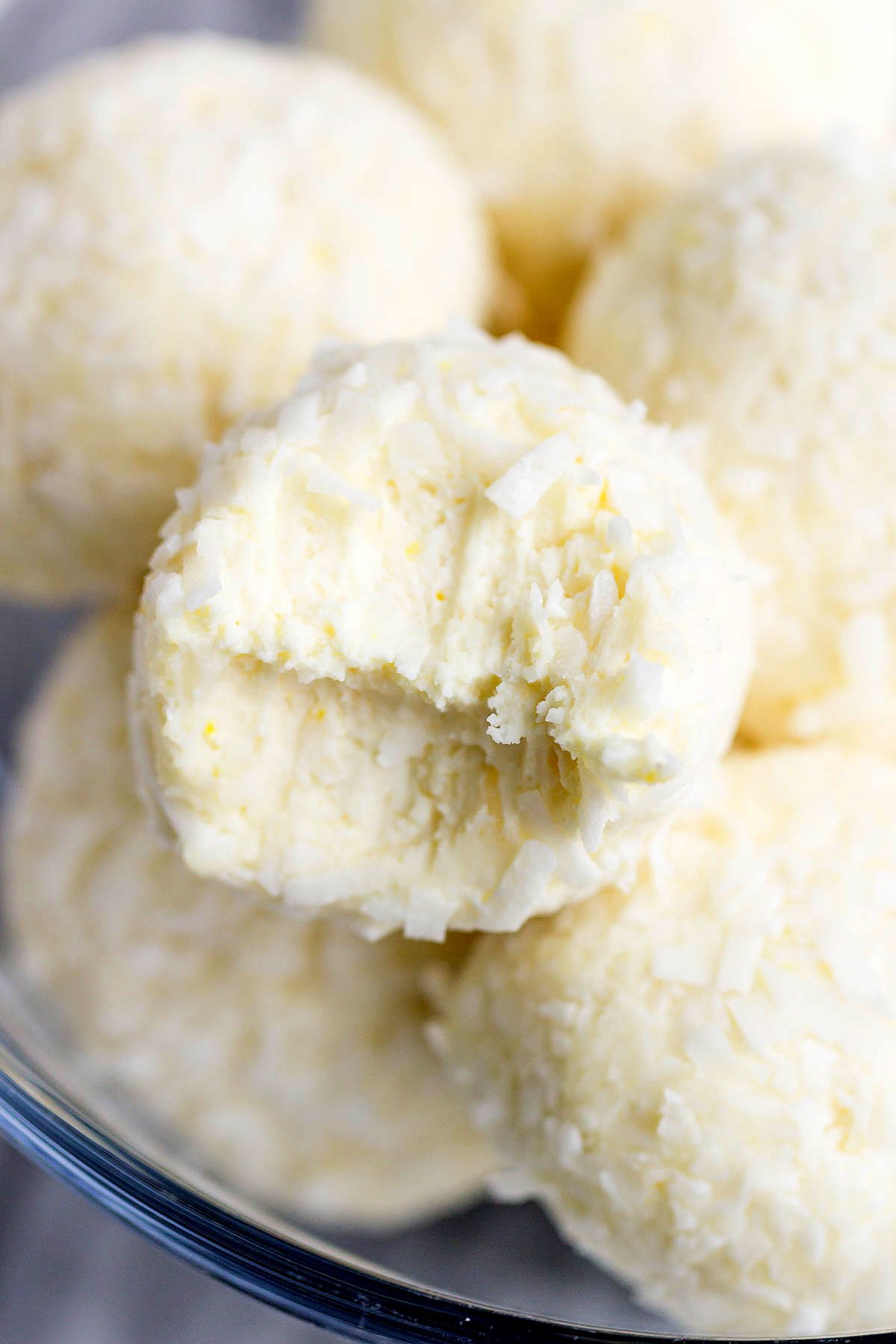 Lemon Cheesecake Keto Fat Bombs - These low-carb, keto fat-bombs are an easy, no-bake frozen treat you can make with simple ingredients. #eatwell101 #recipe #Lemon #Cheesecake #Keto #FatBombs #Lowcarb keto fat boms #low-carb, keto fat boms lemon, keto fat boms coconut oil , keto fat boms recipes, keto fat boms cream cheese, keto snacks, low carb fat bombs, low carb fat boms. 