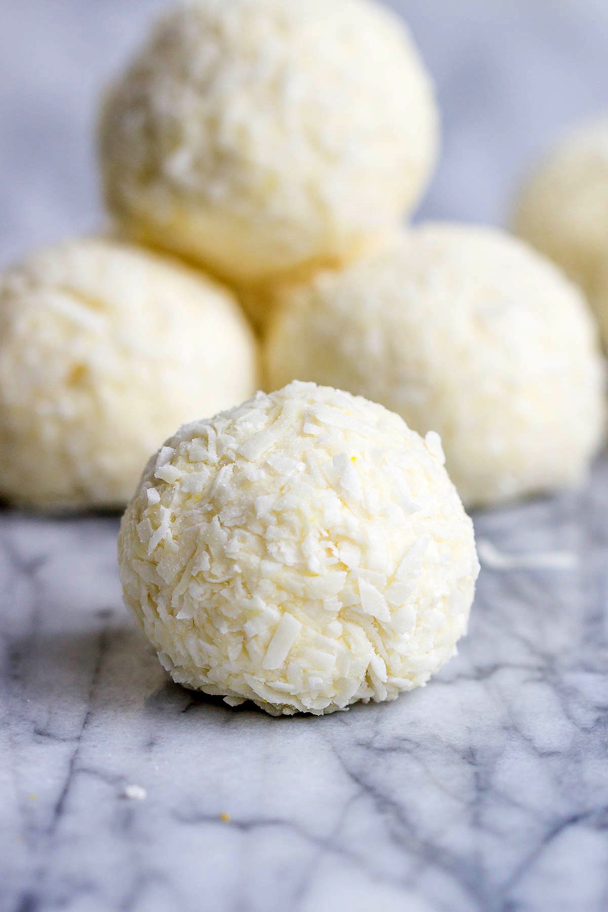 Lemon Cheesecake Keto Fat Bombs - These low-carb, keto fat-bombs are an easy, no-bake frozen treat you can make with simple ingredients. #eatwell101 #recipe #Lemon #Cheesecake #Keto #FatBombs #Lowcarb keto fat boms #low-carb, keto fat boms lemon, keto fat boms coconut oil , keto fat boms recipes, keto fat boms cream cheese, keto snacks, low carb fat bombs, low carb fat boms.