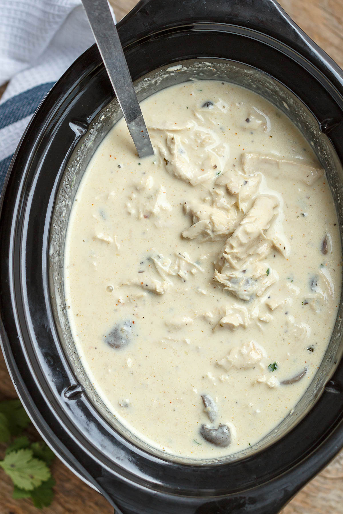 Slow Cooker Turkey Cream Cheese Soup - Rich and velvety, you'll enjoy every spoonful of this hearty turkey cream cheese soup!