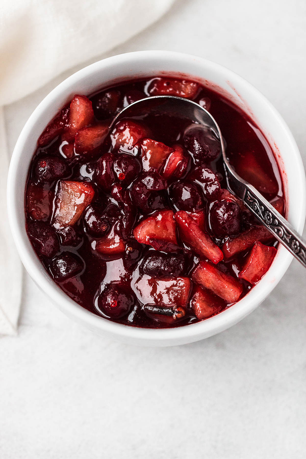 Apple Cranberry Sauce - Our delicious homemade cranberries sauce is simmered to perfection with cranberries, apples, maple syrup, and cinnamon.