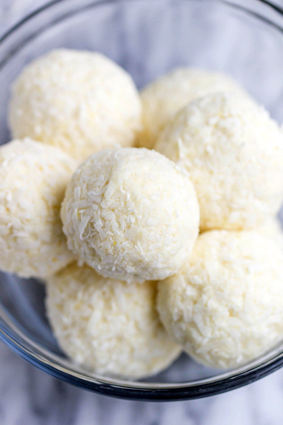 Lemon Cheesecake Keto Fat Bombs - These low-carb, keto fat-bombs are an easy, no-bake frozen treat you can make with simple ingredients. #eatwell101 #recipe #Lemon #Cheesecake #Keto #FatBombs #Lowcarb keto fat boms #low-carb, keto fat boms lemon, keto fat boms coconut oil , keto fat boms recipes, keto fat boms cream cheese, keto snacks, low carb fat bombs, low carb fat boms.
