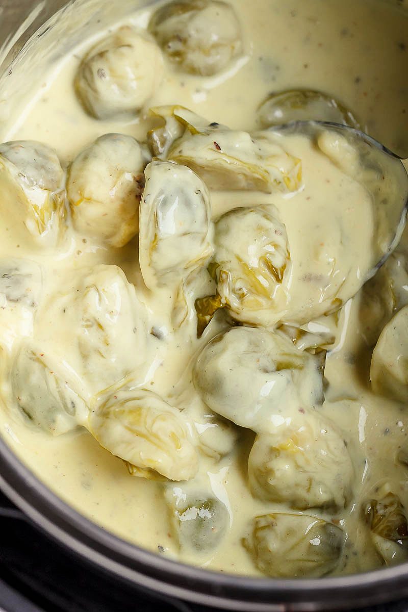 Creamy Instant Pot Brussels Sprouts - #eatwell101 #recipe #keto #lowcarb #glutenfree #vegetarian - Creamy and savory, this side dish with brussels sprouts and bacon is outstanding all on its own!