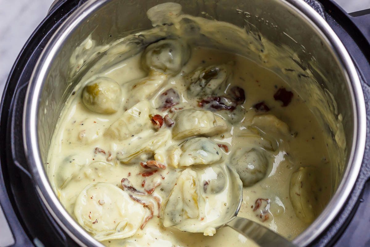 Creamy Instant Pot Brussels Sprouts - #eatwell101 #recipe #keto #lowcarb #glutenfree #vegetarian - Creamy and savory, this side dish with brussels sprouts and bacon is outstanding all on its own!