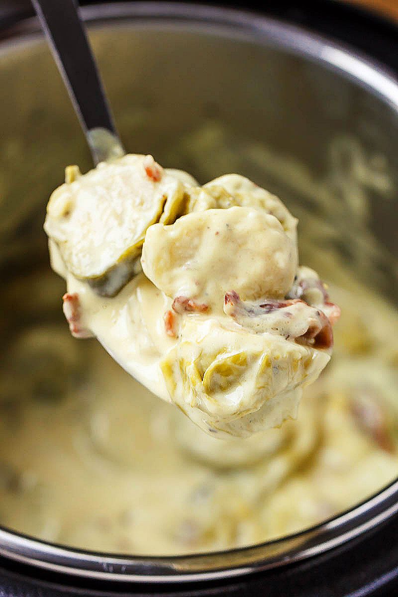 Creamy Instant Pot Brussels Sprouts - #eatwell101 #recipe #keto #lowcarb #glutenfree #vegetarian - Creamy and savory, this side dish with brussels sprouts and bacon is outstanding all on its own!